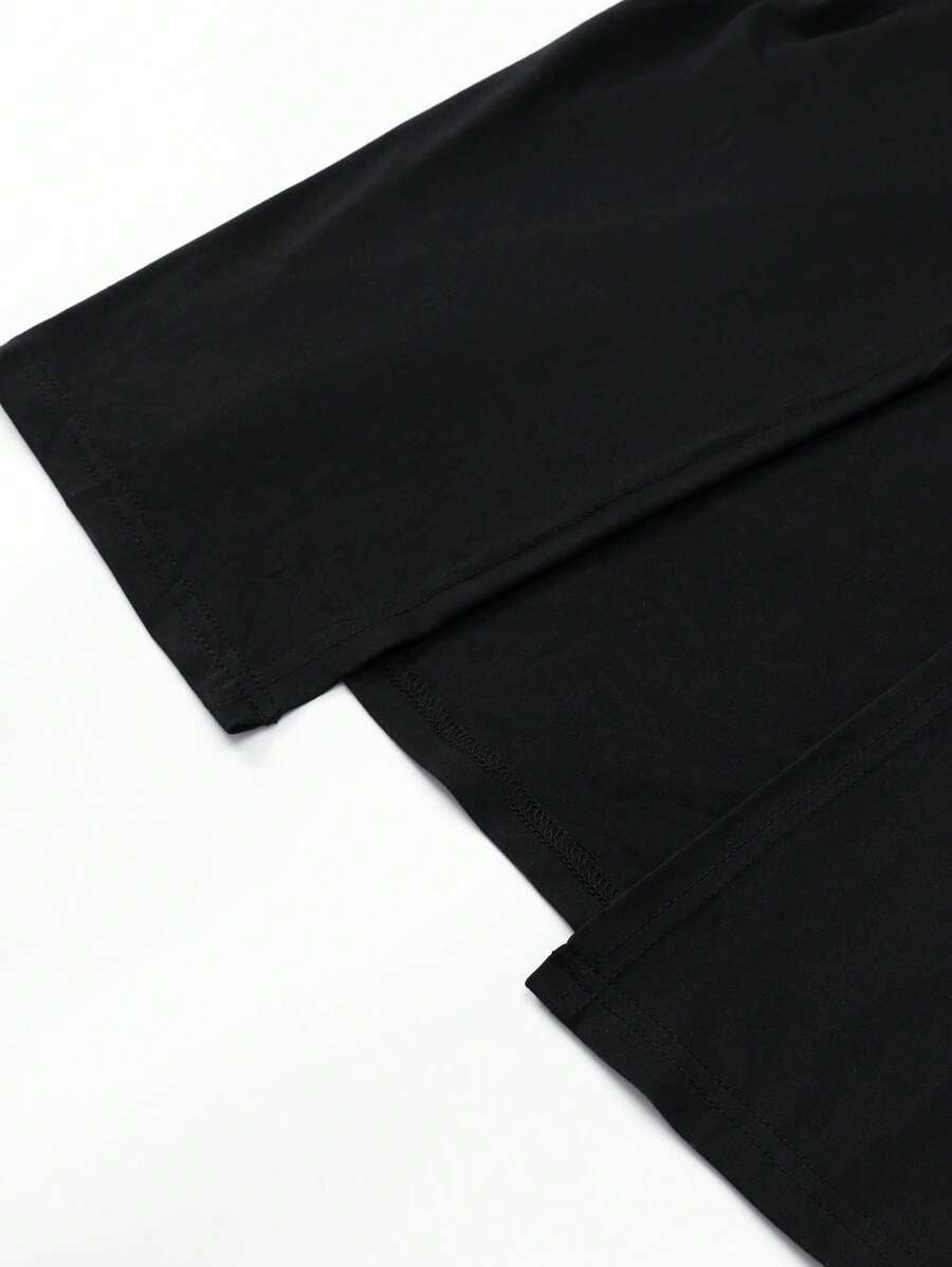 Black mock-neck fitted midi dress side styling view