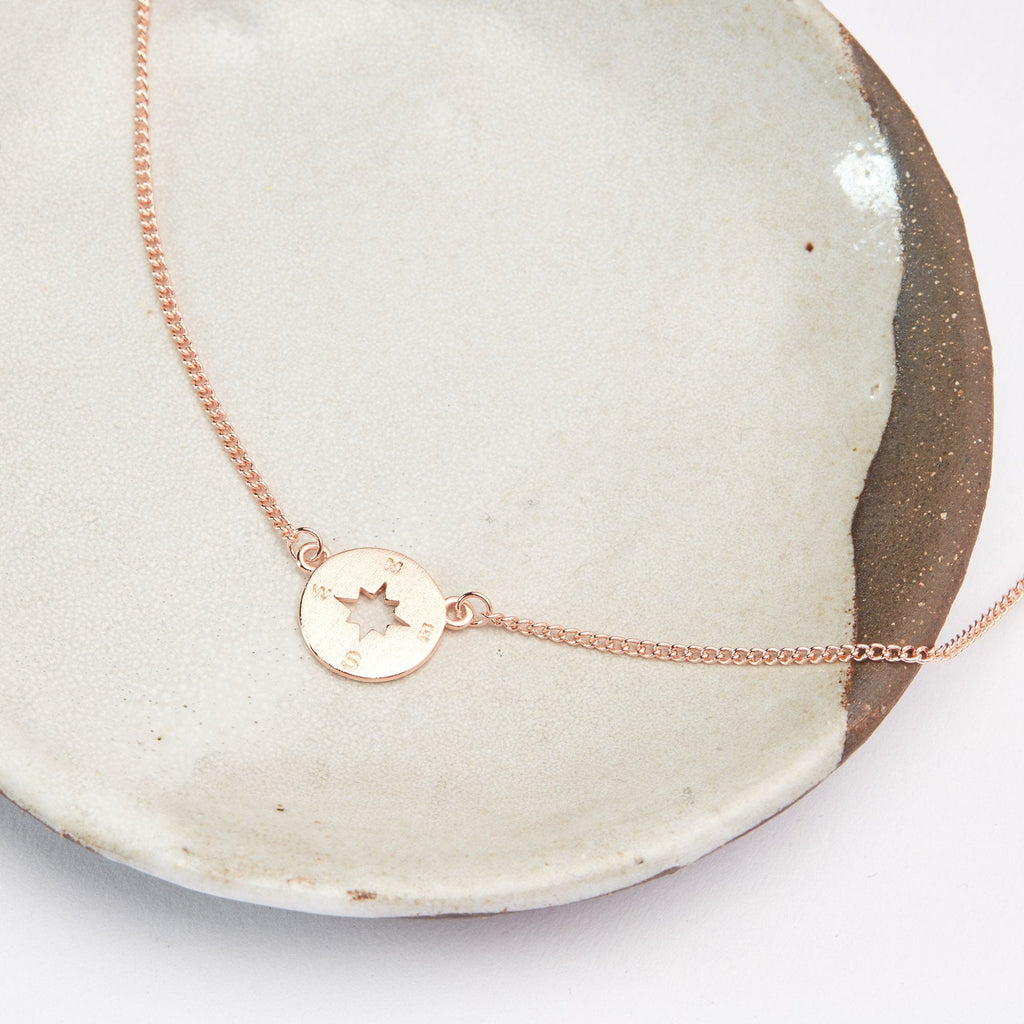 Compass rose gold-plated aunt and niece necklace detail