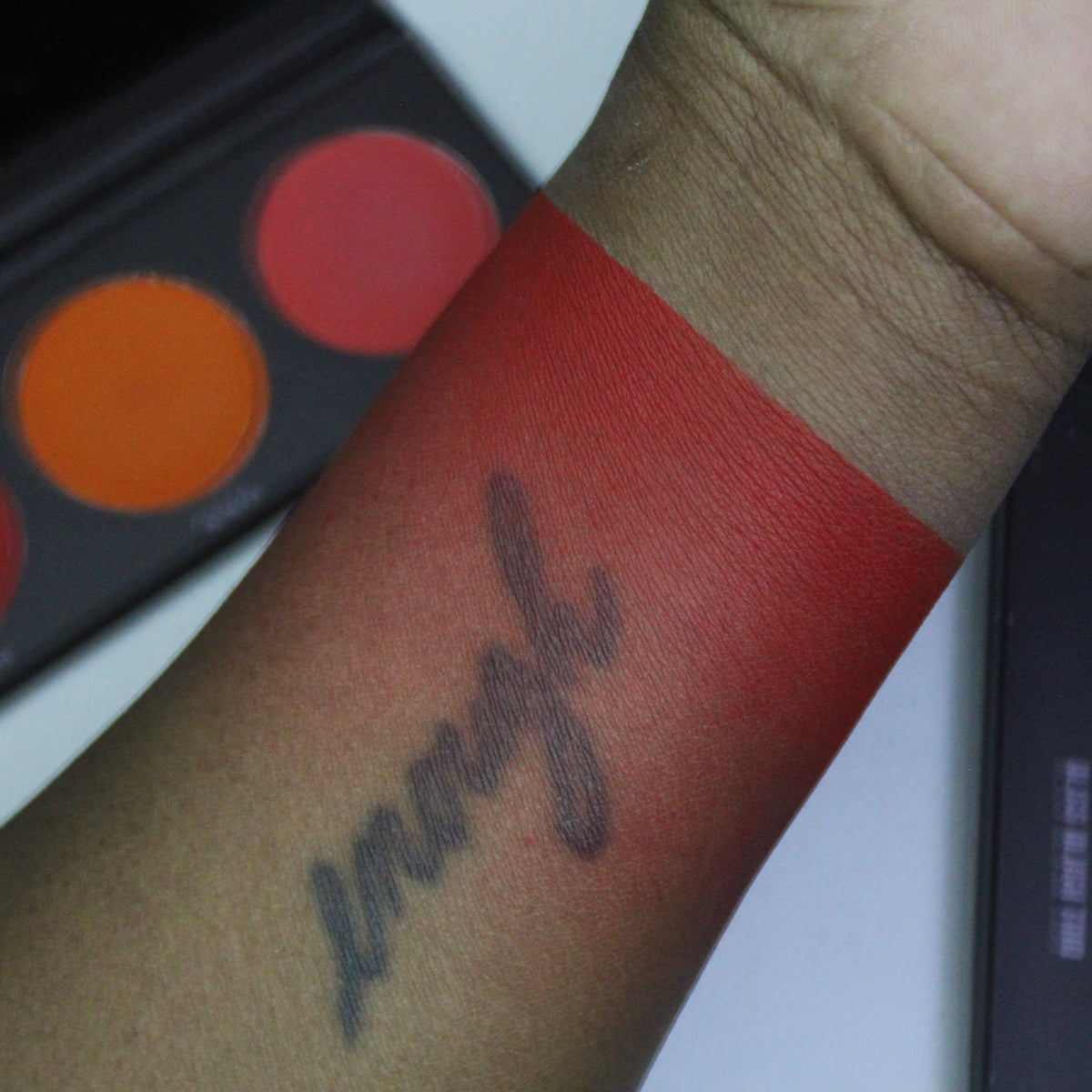 Blush Bliss Trio palette with red, orange, and coral blush shades