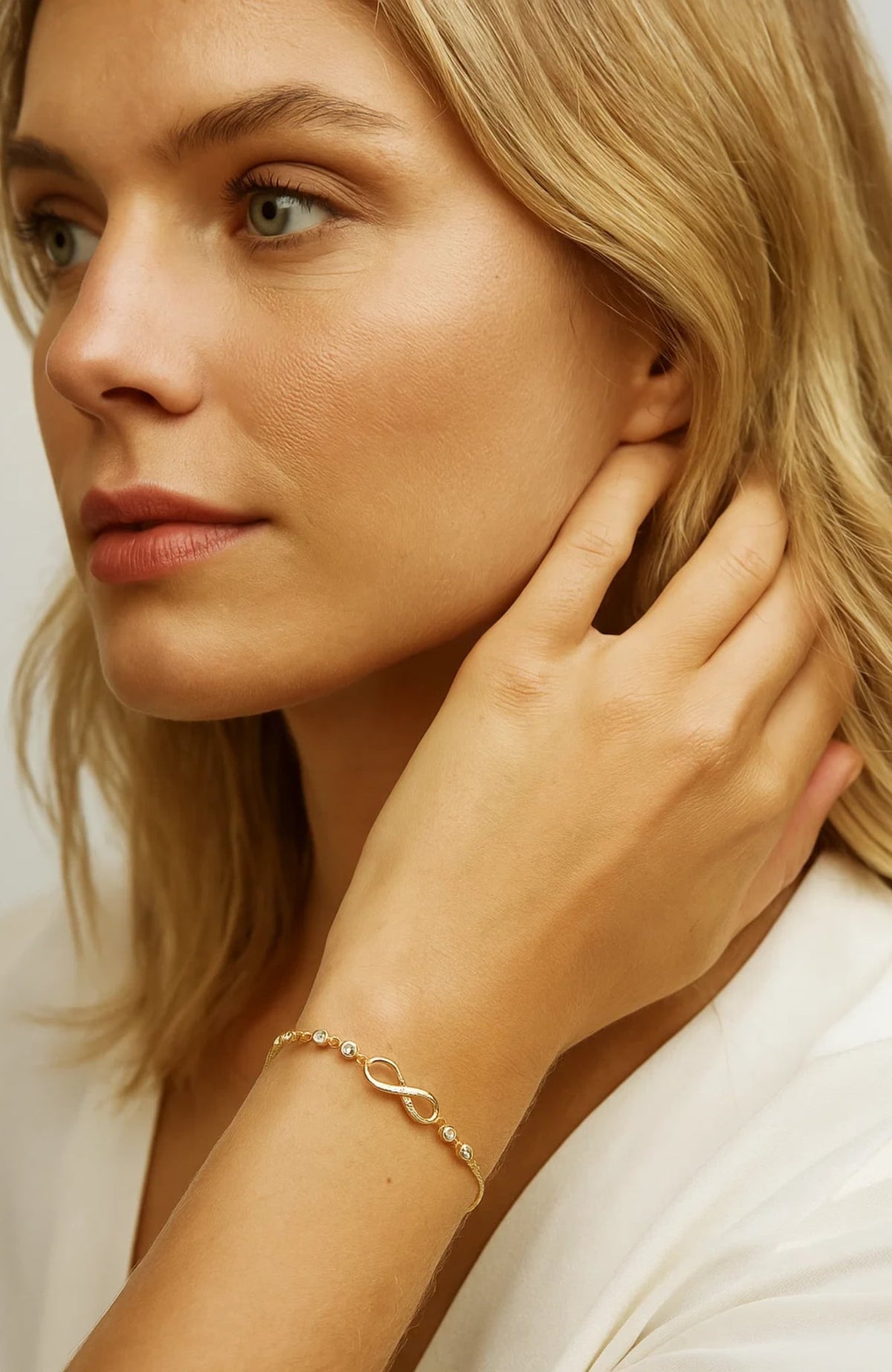 Gold Infinity Bracelet worn on wrist