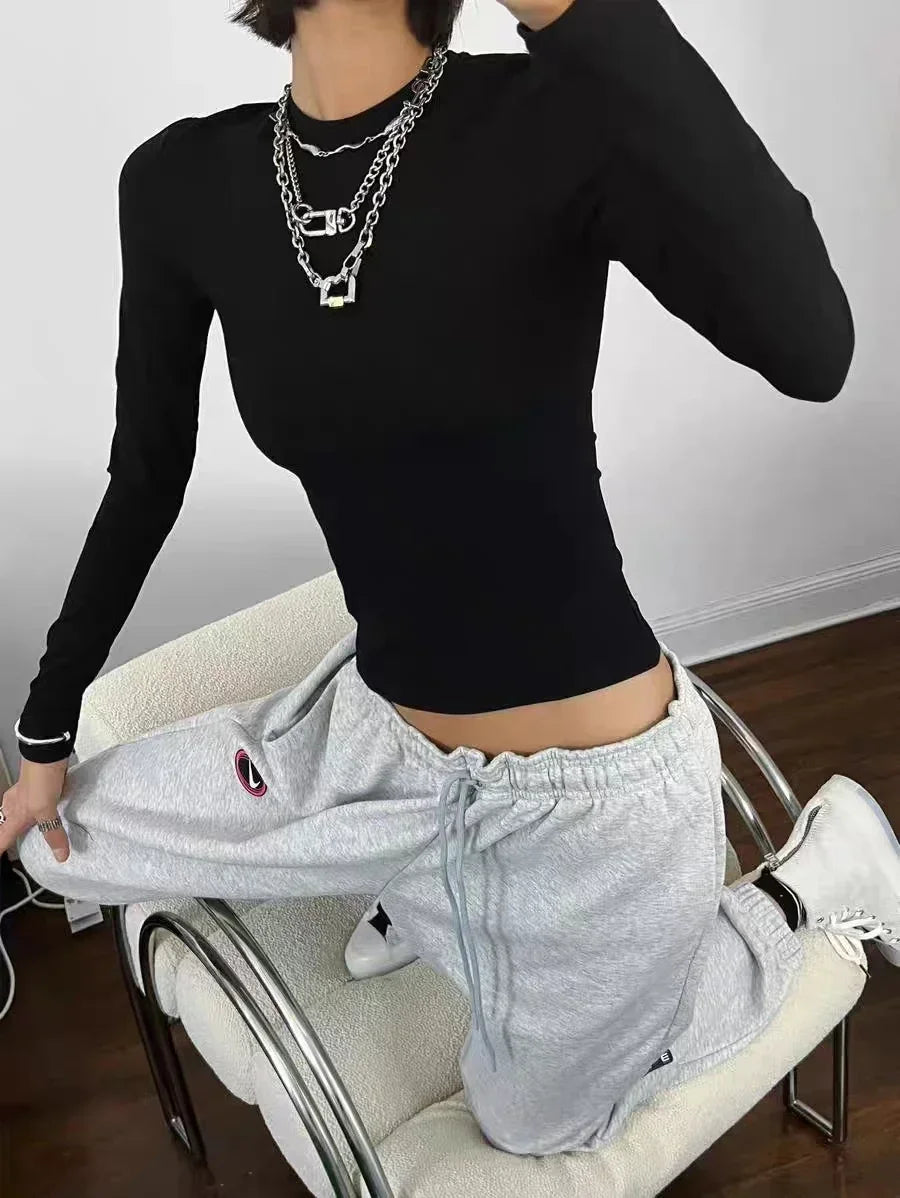Fitted long-sleeve crewneck top front silhouette
