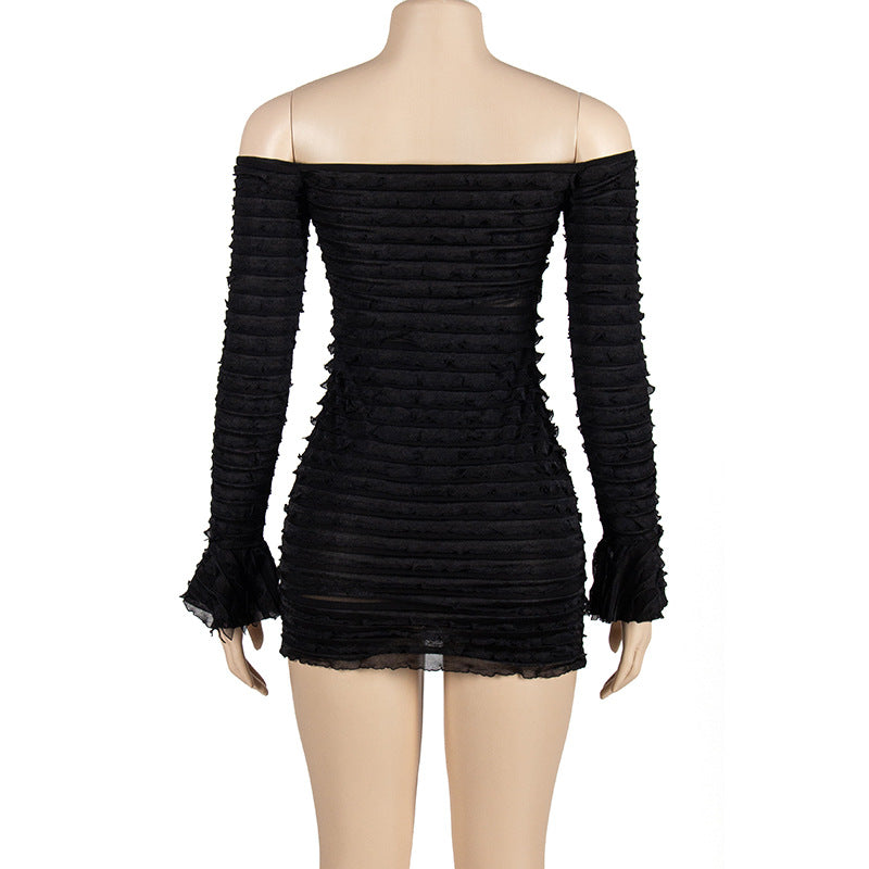 Back view of black ruched off-shoulder mesh mini dress on mannequin