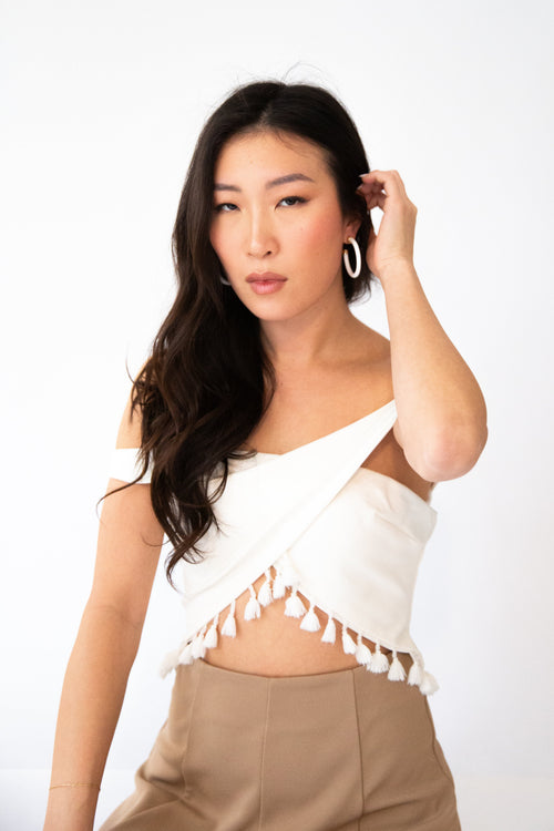 Model wearing 1.5-inch white hoop earrings by hoohoops in close-up