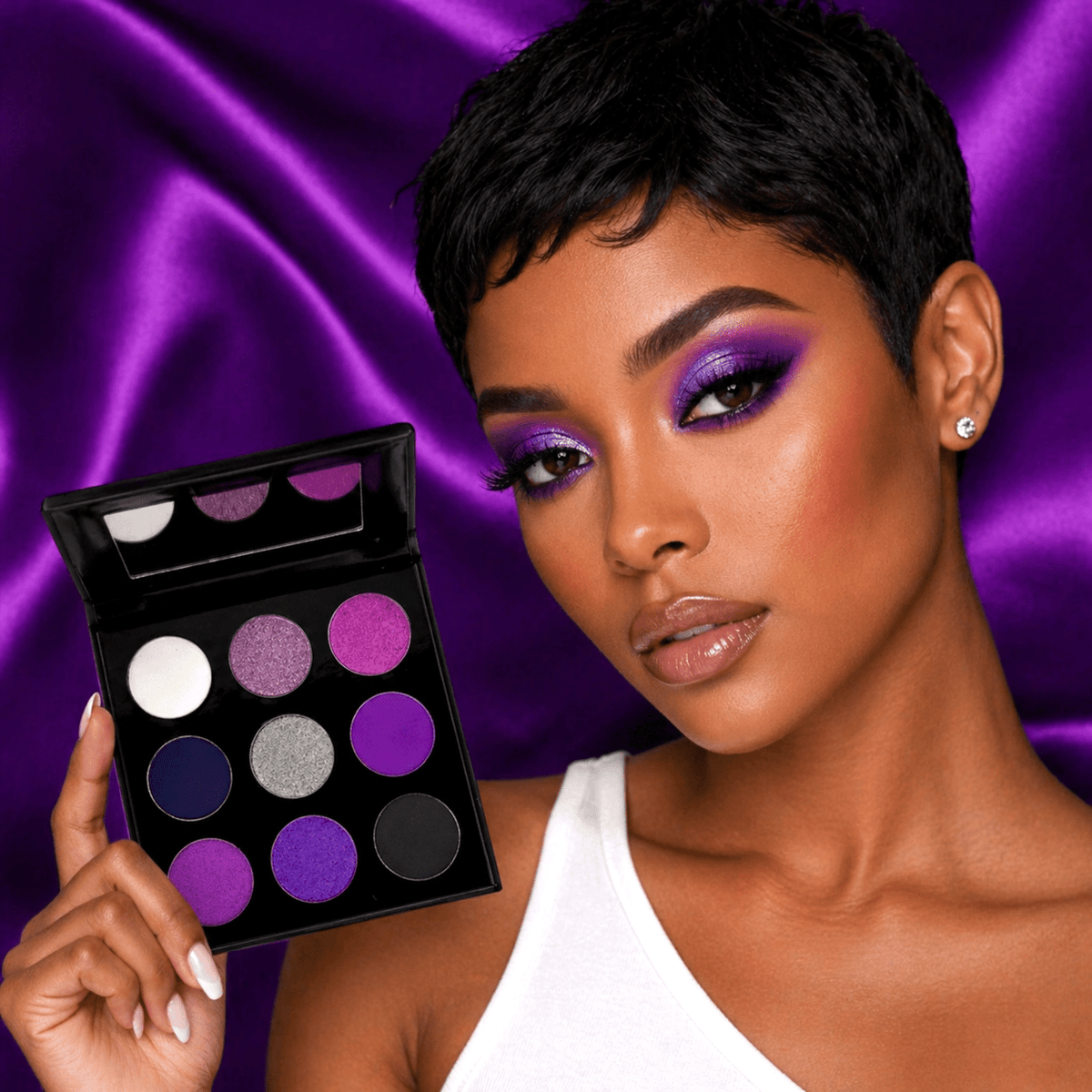 Model wearing a purple eye look created with the REIGN eyeshadow palette