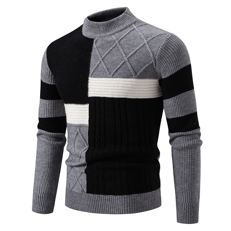 Gray, black, and white patterned sweater on a white background
