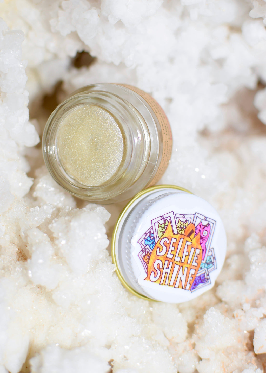 Selfie Shine clear shimmer balm by Plant Makeup in glass jar