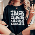 Thick Thighs Make Great Earmuffs graphic tee in Black Heather