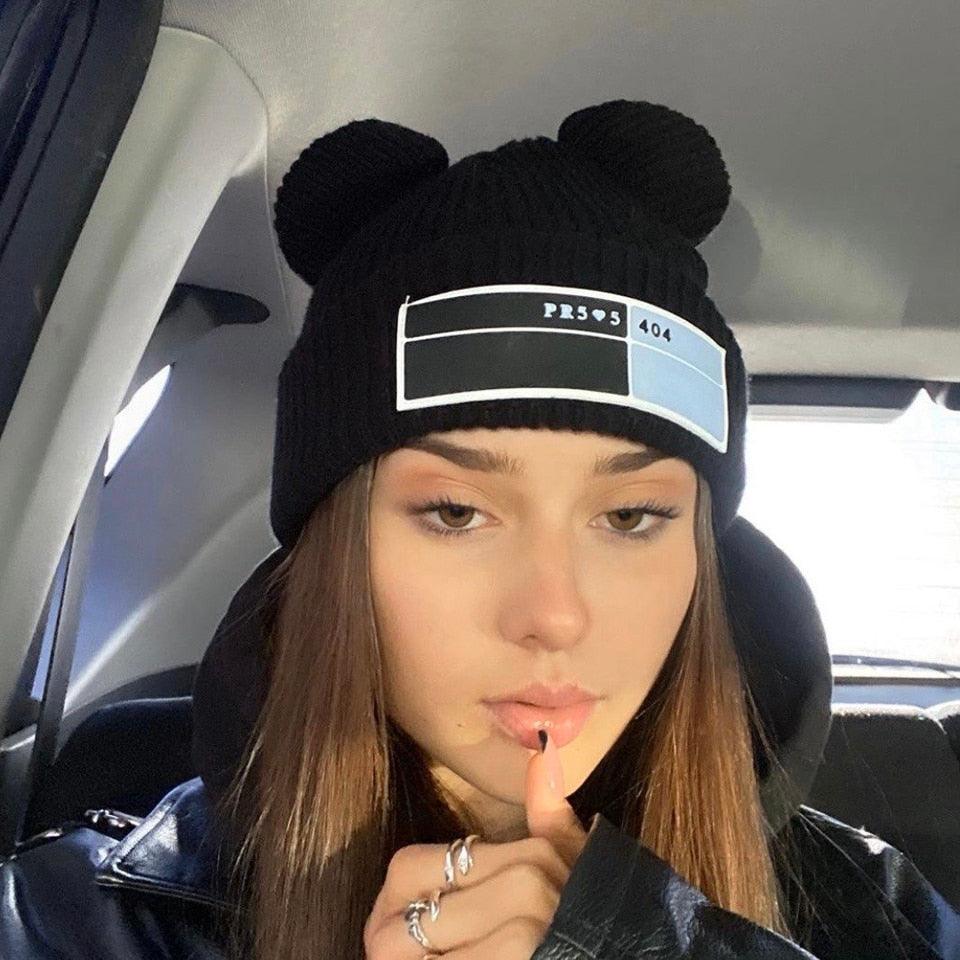 Women’s double-pom cable-knit beanie by Stevvex